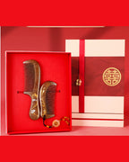 Dragon and Phoenix wedding comb gift set with two hand-painted wooden combs in a red presentation box.
