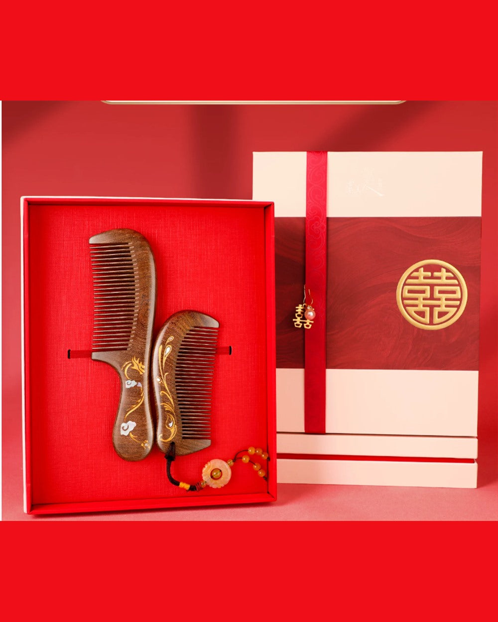 Dragon and Phoenix wedding comb gift set with two hand-painted wooden combs in a red presentation box.
