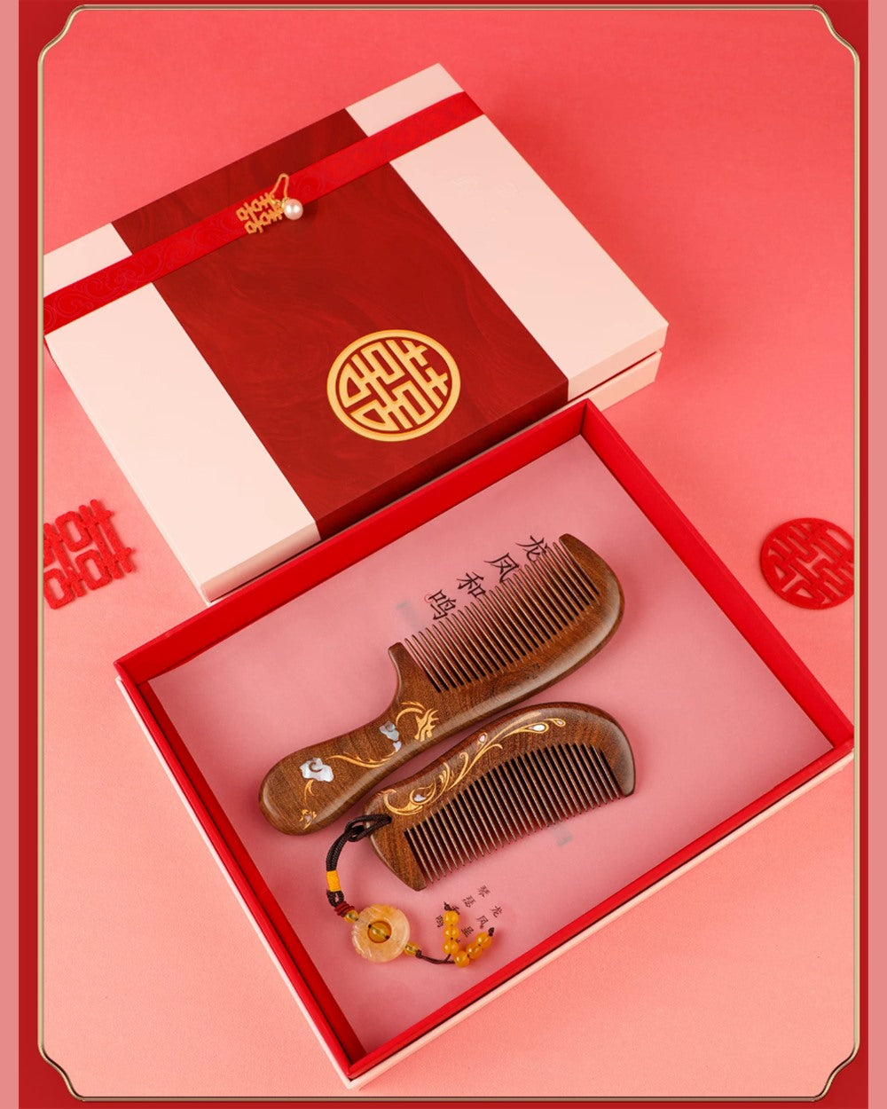 Open Dragon and Phoenix wedding comb gift box with two wooden combs and red presentation packaging.
