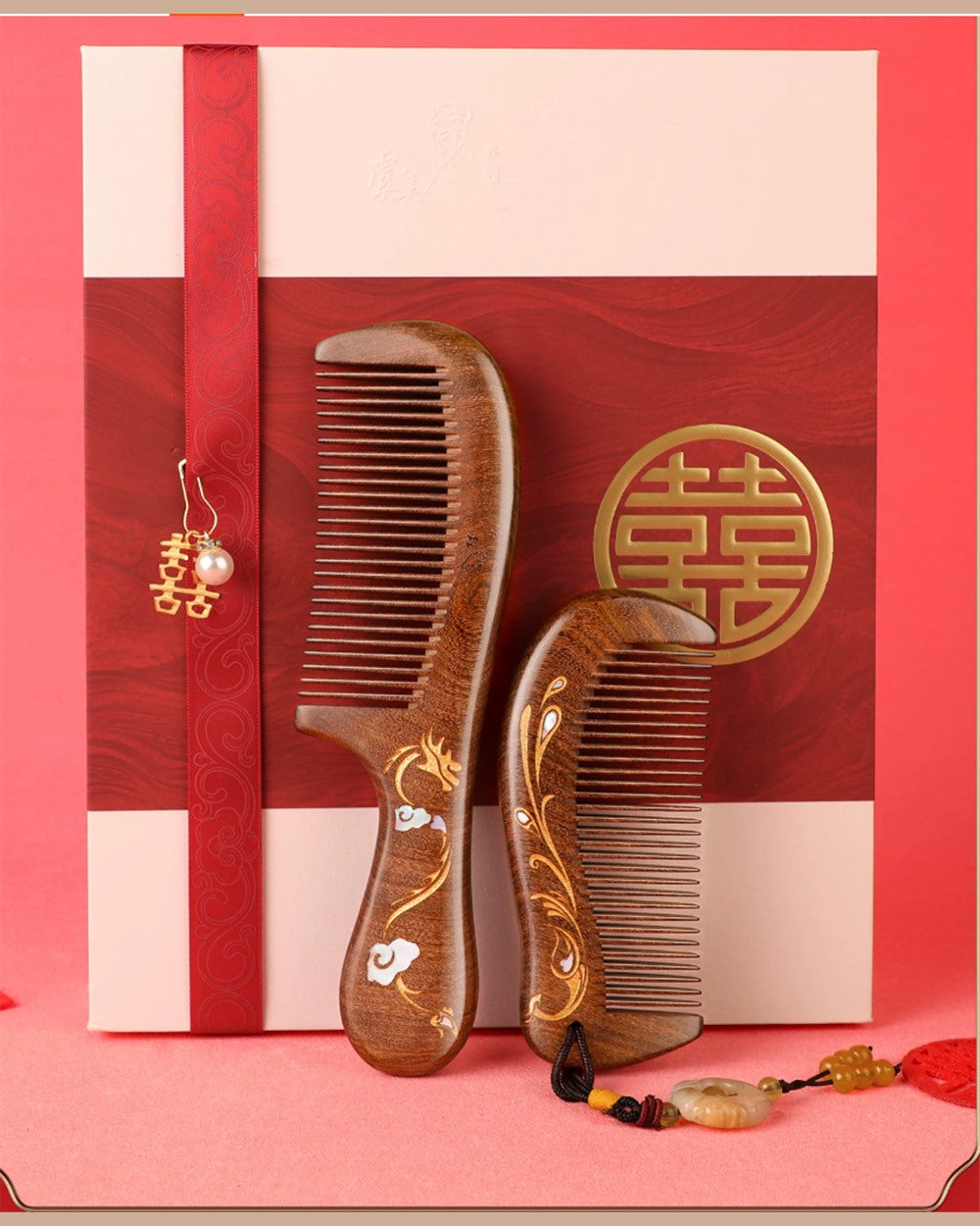 Dragon and Phoenix wedding combs displayed in front of the matching red and cream gift box.
