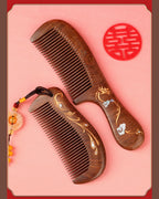 Black Sandalwood Dragon and Phoenix combs with gold painted motifs and natural wood grain.
