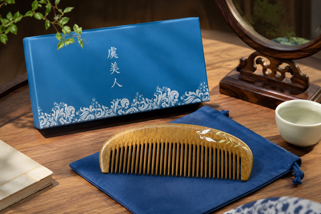 Wooden comb on a blue cloth with a blue pouch and white cup in the background