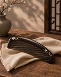 Hand-carved African rosewood hair comb with traditional lacquer artwork