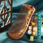 Black sandalwood comb with shimmering Fengming phoenix mother-of-pearl motif