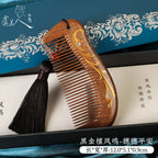 Black sandalwood comb with decorative charm – gift-ready presentation