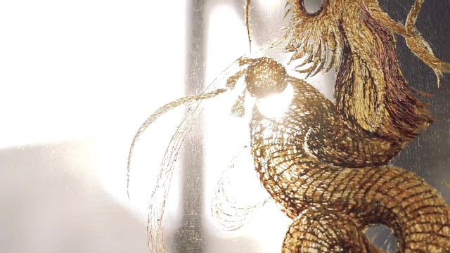 Detailed golden silk thread work in Changzhou Random Stitch Embroidery, a Chinese intangible cultural heritage craft