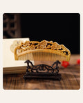 Hand-carved plum blossom wooden comb with double-sided floral carving
