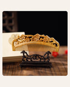 Hand-carved plum blossom wooden comb with double-sided floral carving
