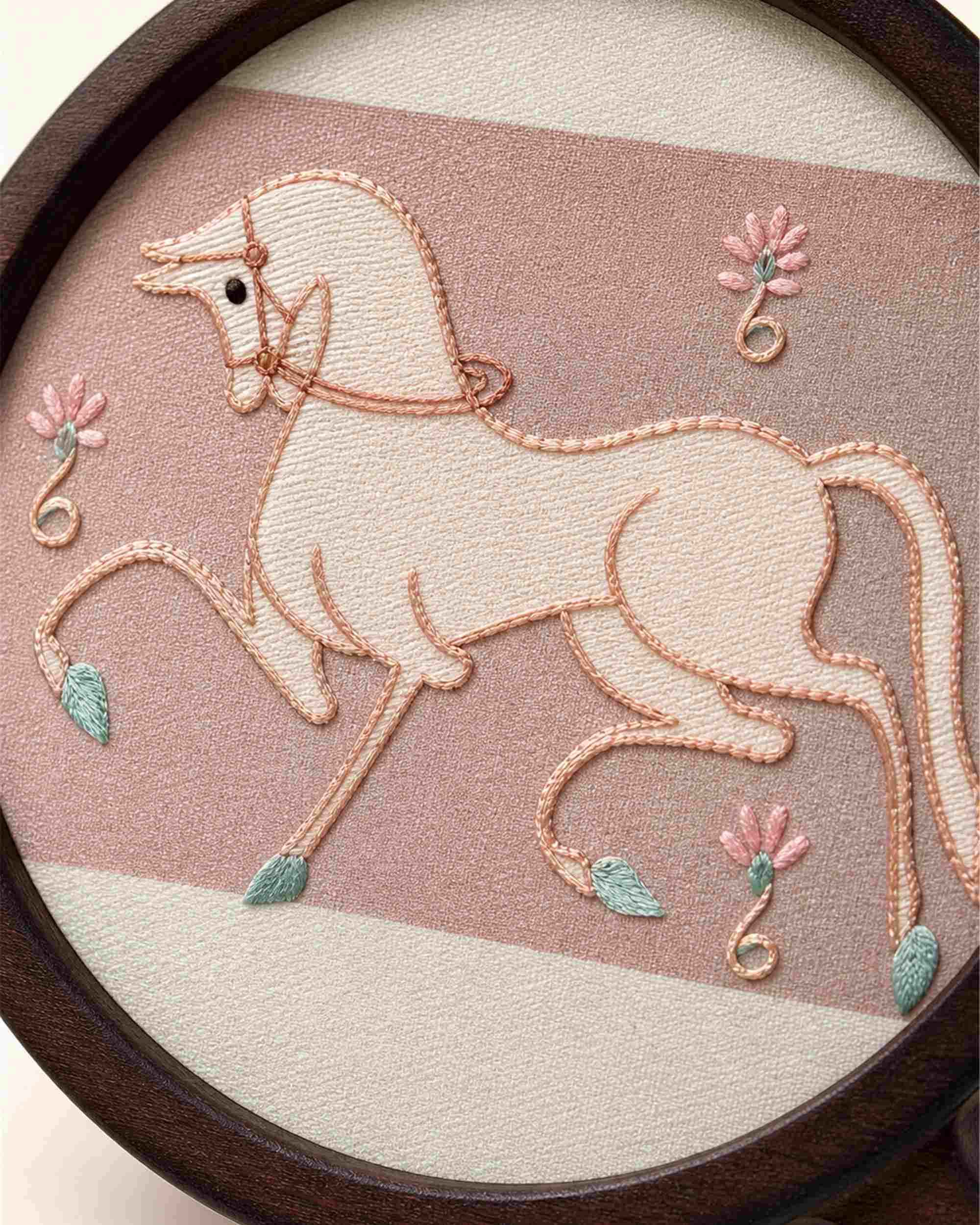 Close-up of handmade mulberry silk embroidery — Lucky Horse motif in Changzhou Random-Stitch technique